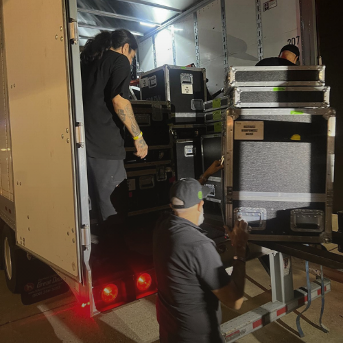 AV technical team managing equipment setup across a large-scale event venue