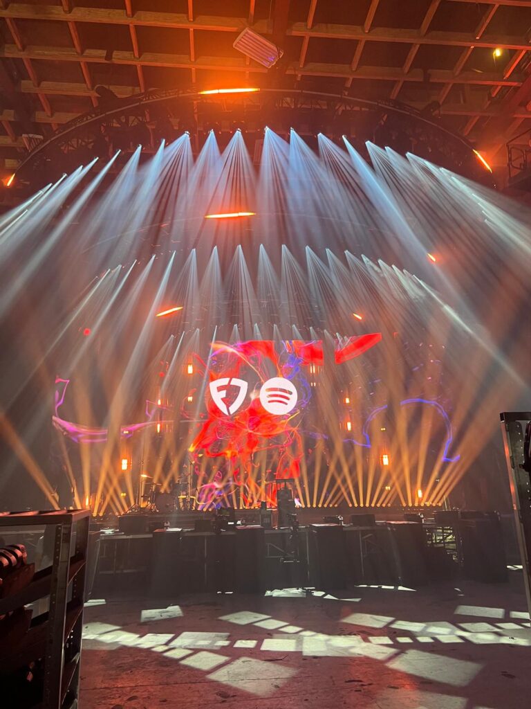 A professional AV setup for corporate events including high-definition LED displays and stage lighting for a large conference.
